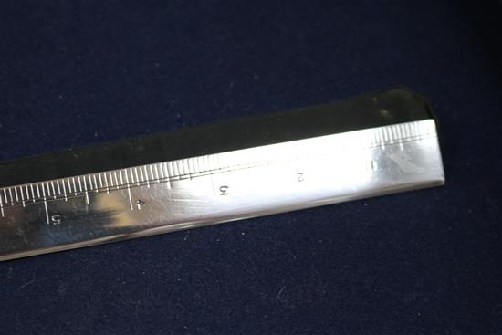 An Asprey & Co. silver ruler, London, 1936.